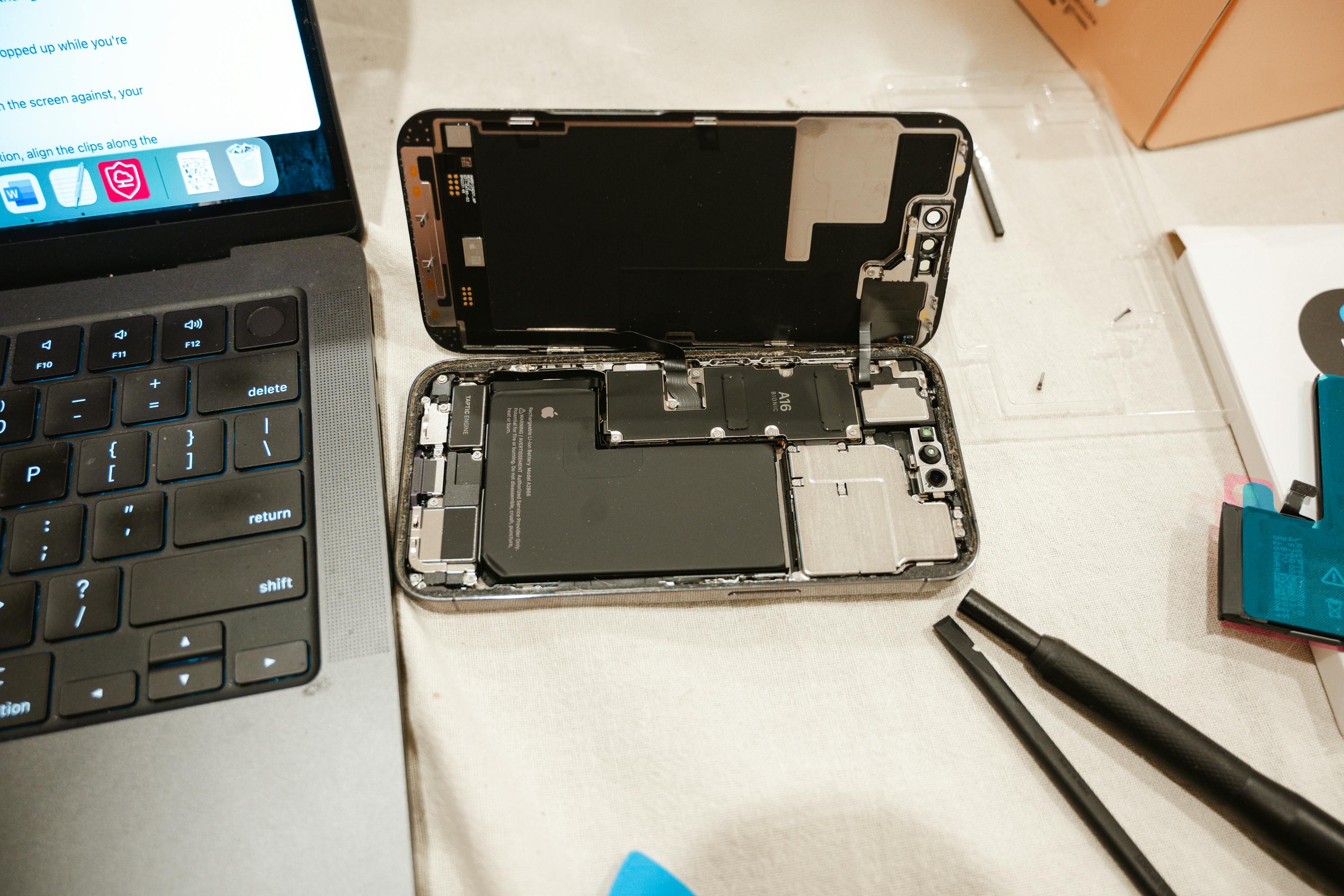 Technician carrying out device diagnostics on a clean workstation